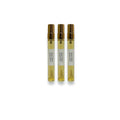 Three Spicy Amber perfume spray bottles with gold caps on a white background